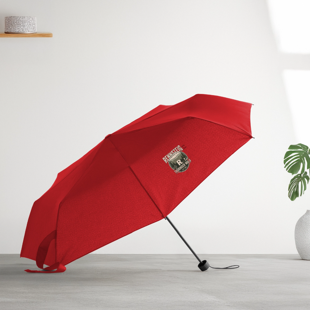 Kleiner Regenschirm in Rot mit Rennsteig-Logo am Schirm